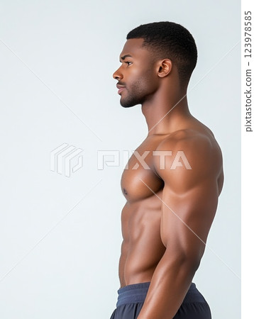 Male athlete executing core workout with perfect form in studio 123978585