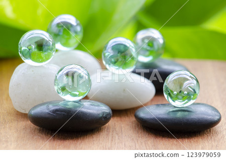Glass marbles representing peace and harmony with customizable space for text of message. Peace concept Glass marbles representing peace and harmony with customizable space for text of message. Peace concept 123979059
