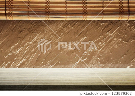 Minimal Table with Japanese Wooden Blinds and Rough Stucco Background 123979302