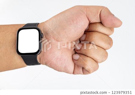 A chubby Asian man with yellow skin wearing a black smartwatch on his inner wrist with a white screen. 123979351