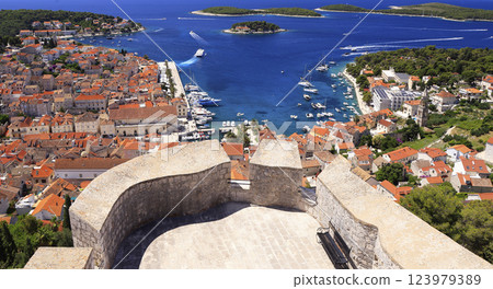 Panoramic aerial view of harbor of Hvar with Adriatic Sea and boats, Croatia Panoramic aerial view of harbor of Hvar with Adriatic Sea and boats, Croatia 123979389