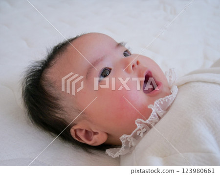 Baby turning over Baby turning over 123980661