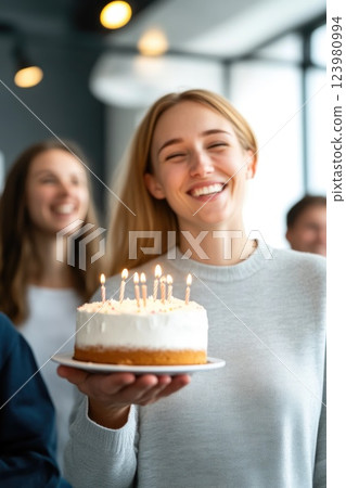 Celebrating Office Birthday with Cake and Smiles 123980994