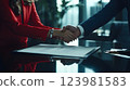 Closeup two business partners doing handshake over desk after signing contract, showing elegance and trust. Handshake symbolizes partnership, cooperation, handshake seals the deal. 123981583