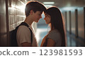Teenage romance captured school hallway atmosphere, sweet moment between young couple, first feelings romance sharing looks silently, gentle lighting highlighting innocent teenage romance. 123981593