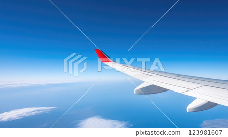 Contrails marking the sky from airplane wing Contrails marking the sky from airplane wing 123981607