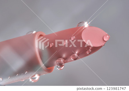 Classic lipstick with drops of water on a neutral background. 123981747