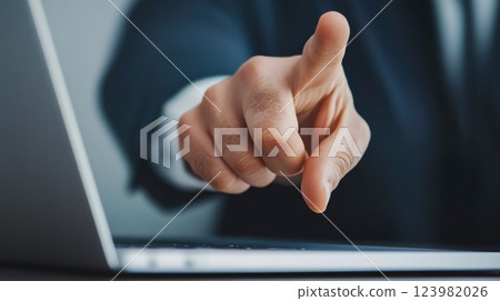 Boss pointing finger at laptop screen during heated discussion Boss pointing finger at laptop screen during heated discussion 123982026