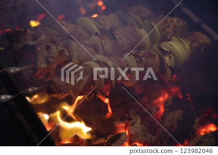 Texture red hot coals, selective focus. Barbecue grill dark background. 123982046