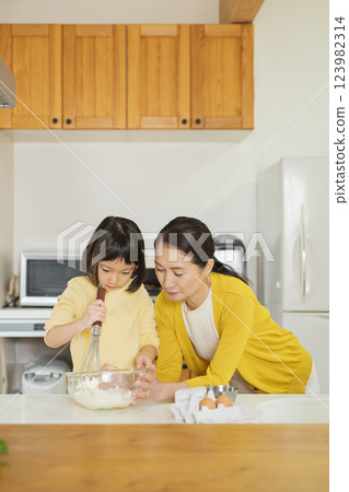 Grandmother and grandson cooking 123982314