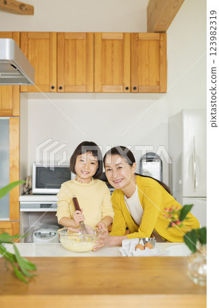 Grandmother and grandson cooking Grandmother and grandson cooking 123982319