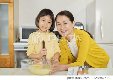 Grandmother and grandson cooking 123982320