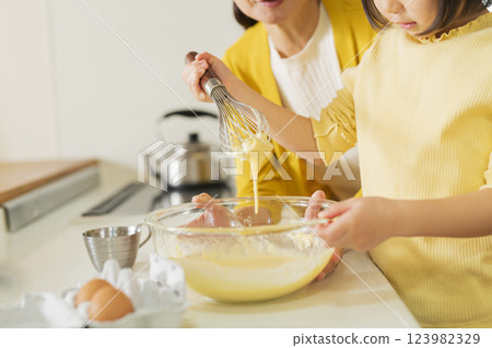 Grandmother and grandson cooking 123982329