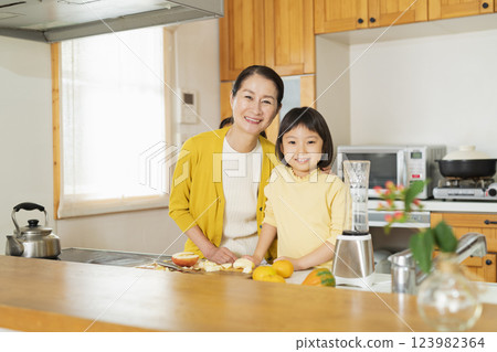 Grandmother and grandson cooking Grandmother and grandson cooking 123982364