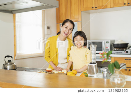 Grandmother and grandson cooking Grandmother and grandson cooking 123982365