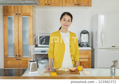 Senior woman in the kitchen 123982372