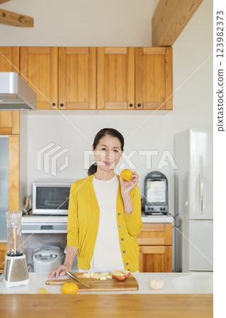 Senior woman in the kitchen Senior woman in the kitchen 123982373