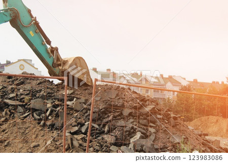 Tractor digging trench repair construction work Tractor digging trench repair construction work 123983086