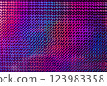 A vibrant, textured surface featuring a mesmerizing blend of purple, pink, and blue hues, reflecting light in a geometric pattern. 123983358