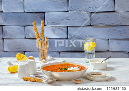 Red Lentil Tomato Soup with sour cream in a bowl Red Lentil Tomato Soup with sour cream in a bowl 123983460