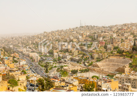 Lots of residential houses on the hills with ancient roman amphitheater in the Al Balad downtown of Amman city, Kingdom of Jordan Lots of residential houses on the hills with ancient roman amphitheater in the Al Balad downtown of Amman city, Kingdom of Jordan 123983777
