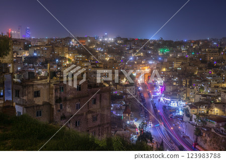 Night panorama of Amman city downtown with lots of glowing streets and highlighted houses, Kingdom of Jordan 123983788