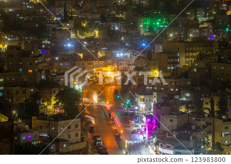 Nightlife panorama of Amman city downtown with lots of glowing streets and highlighted houses, Kingdom of Jordan Nightlife panorama of Amman city downtown with lots of glowing streets and highlighted houses, Kingdom of Jordan 123983800