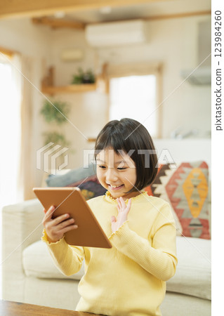 Elementary school student using tablet device Elementary school student using tablet device 123984260