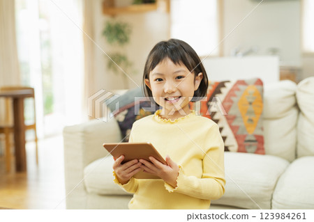 Elementary school student using tablet device Elementary school student using tablet device 123984261