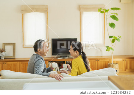 Elderly couple relaxing in the living room 123984282