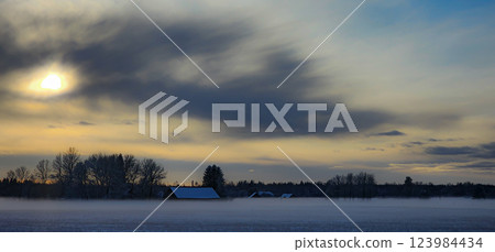 Winter fog near the single house in forest 123984434