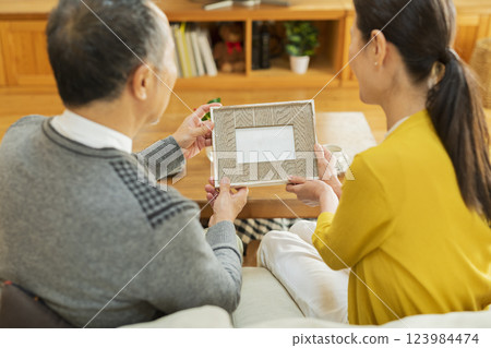 elderly couple looking at photos 123984474