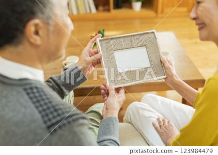 elderly couple looking at photos 123984479