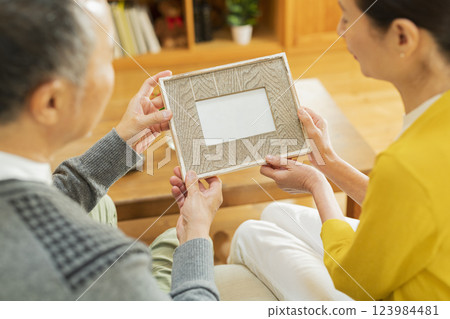 elderly couple looking at photos 123984481