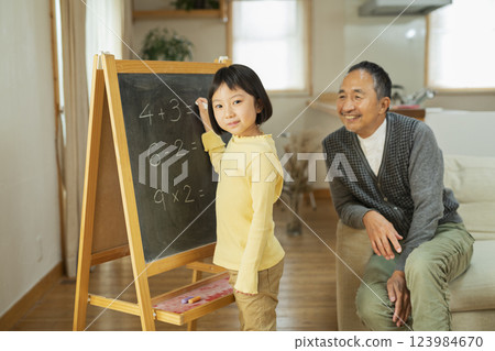 Grandfather and grandson studying Grandfather and grandson studying 123984670