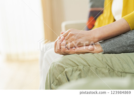 Hands of an elderly couple hugging each other Hands of an elderly couple hugging each other 123984869