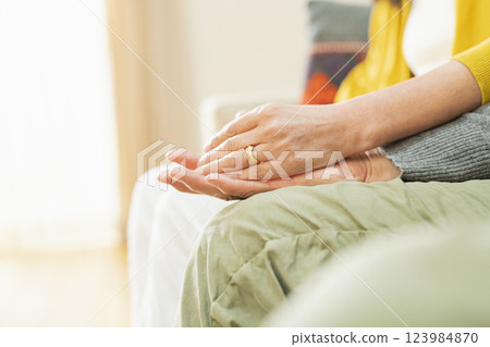 Hands of an elderly couple hugging each other Hands of an elderly couple hugging each other 123984870