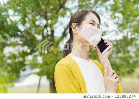 Senior woman wearing a mask 123985274