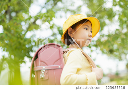 Elementary school students on the way to school 123985316