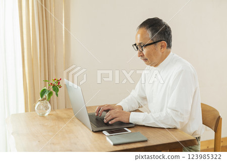 Senior man working remotely 123985322
