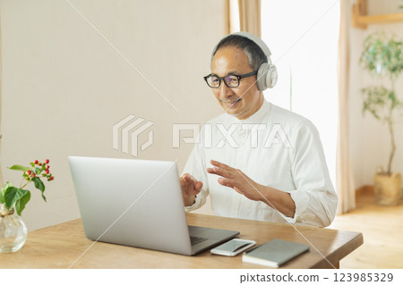 Senior man working remotely Senior man working remotely 123985329