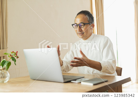 Senior man working remotely Senior man working remotely 123985342