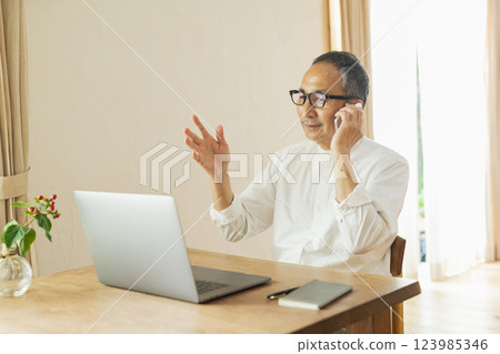 Senior man working remotely 123985346