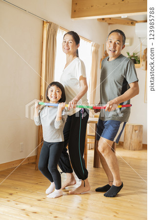 Grandparents and grandchildren exercising at home Grandparents and grandchildren exercising at home 123985788