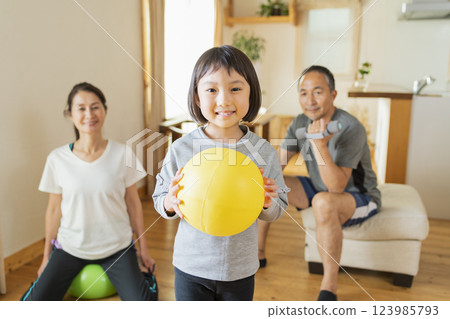 Grandparents and grandchildren exercising at home 123985793