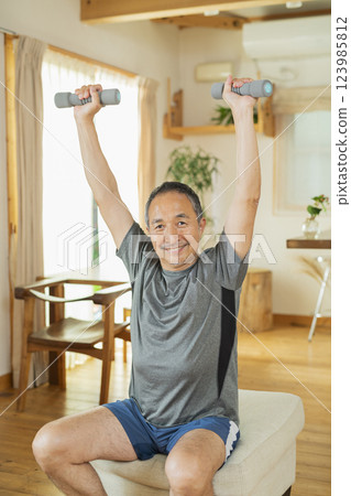 Senior male exercising 123985812