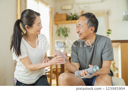 Senior couple exercising indoors 123985904
