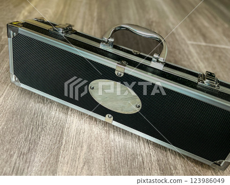 Suitcase on the wooden floor in the hotel room. Selective focus. 123986049