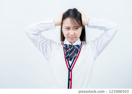 Girls' high school students suffering from having their heads 123986503