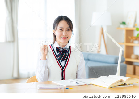 Girls high school studying at home Girls high school studying at home 123986510